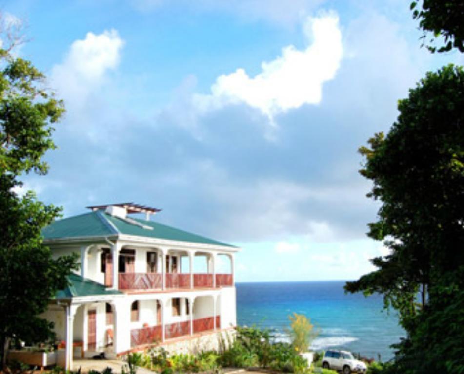Отель Calibishie Cove Экстерьер фото